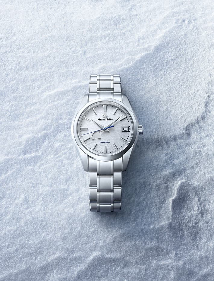 Grand Seiko SBGA211 'Snowflake' Spring Drive watch on snow